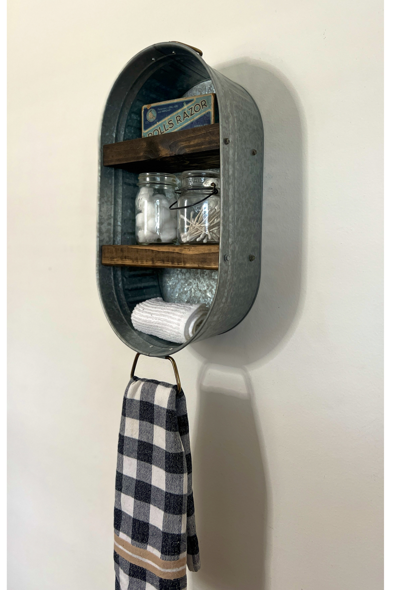 Wall-mounted oval shelf with a checkered towel hanging on a white wall Galvanized Metal Washtub Shelf, Metal tub, Rustic Farmhouse Bathroom Shelf, Metal Washtub Shelf, Farmhouse Bathroom Shelf, Galvanized tub shelf